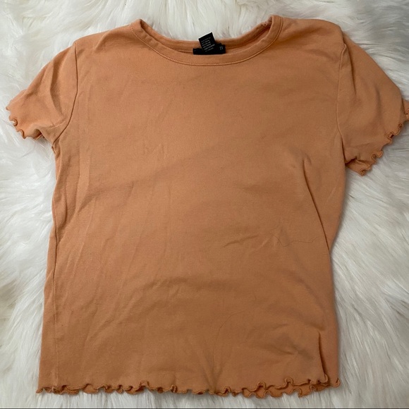 A sherbet orange colored short sleeve shirt - Picture 1 of 1